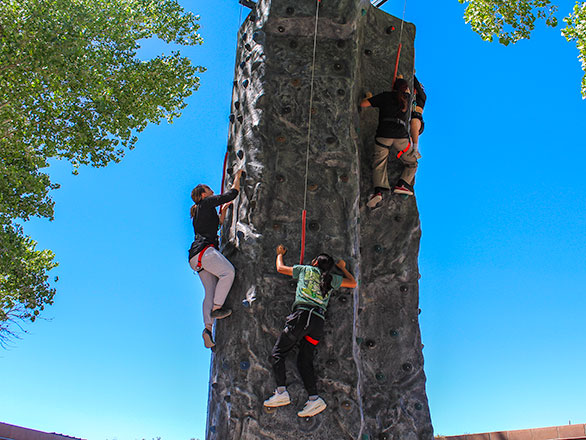 campers climbing up the climbing tower