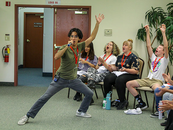 camper singing on karaoke night