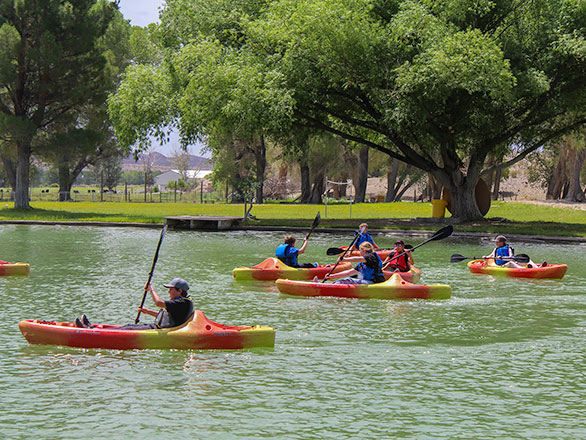 campers kayaking on the lake