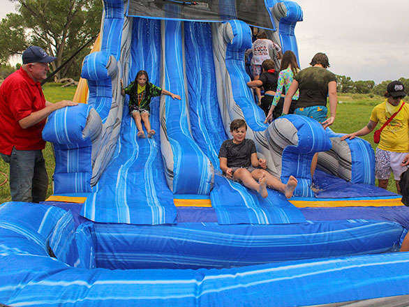 campers hitting the slip-and-slide
