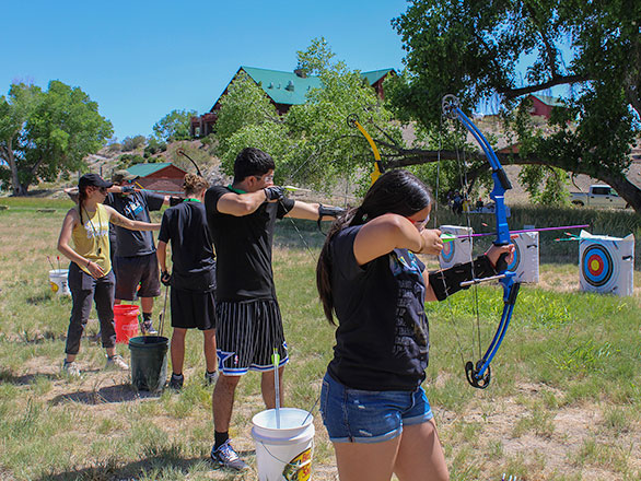 campers working on their archery skills