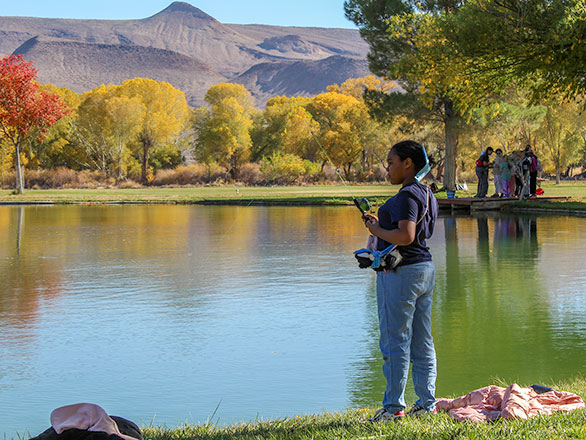 camper fishing in the lake