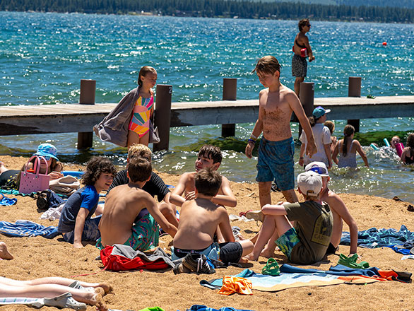 campers hanging out on the beach