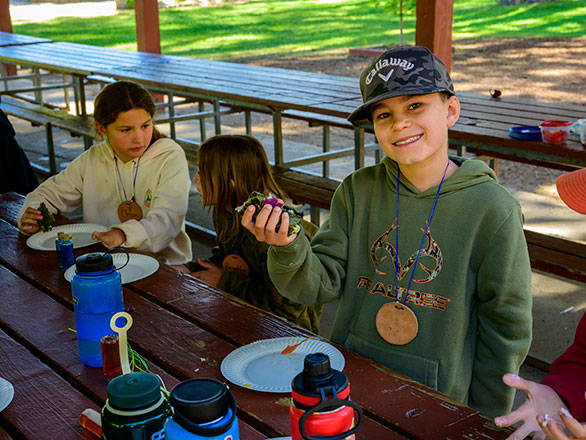 camper showing off their sushi roll
