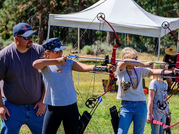 campers working on their archery skills