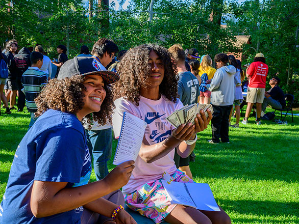 campers playing game to teach finacial responsibilities