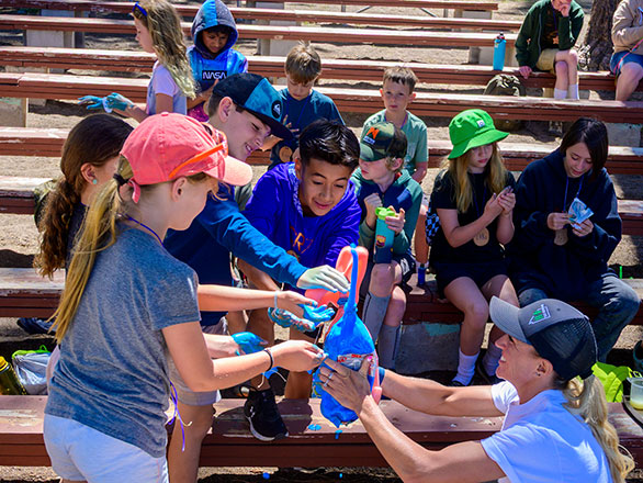 campers learning about chemistry using baking soda and vinegar 