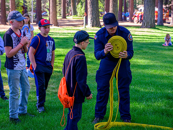 campers learning about being a firefighter
