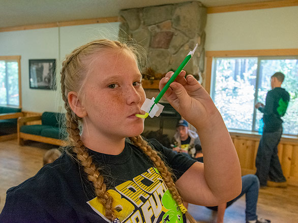 camper showing off their straw rocket